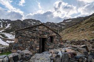 Rural cabin with the typical dry stone wall in Arcalis, Ordino in Andorra. photo