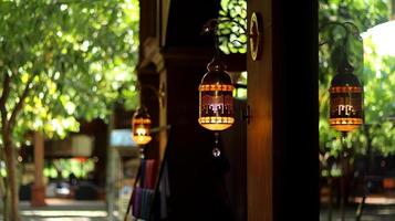 chandeliers or lanterns that are uniquely shaped, attractive and aesthetic. geometric shaped lamp. the lamp that glows orange red color. photo