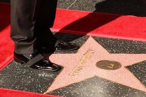LOS ANGELES   DEC 4 - Ryan Murphy shoes on his WOF Star at the Ryan Murphy Star Ceremony on the Hollywood Walk of Fame on December 4, 2018 in Los Angeles, CA photo
