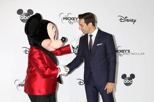 LOS ANGELES   OCT 6 - Mickey Mouse, Skylar Astin at the Mickey s 90th Spectacular Taping at the Shrine Auditorium on October 6, 2018 in Los Angeles, CA photo
