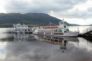 Loch Lomond in the UK in August 2021. A view of Loch Lomond in Scotland in the morning sunshine showing Tourist boats photo