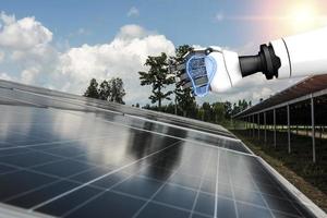 Creative concept with 3D rendering robot holding a light bulb above the solar panel. photo