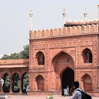 Delhi, India - April 15, 2022 - Unidentified Indian tourists visiting Jama Masjid during Ramzan season, in Delhi 6, India. Jama Masjid is the largest and perhaps the most magnificent mosque in India photo