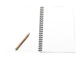 notebook and pencil isolated on white background photo