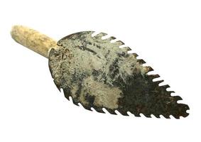 old trowel isolated on white background photo