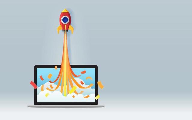 Startup business project concept with red origami rocket or space ship launch from laptop screen on gray background