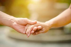 Men and women shake hands with love on valentines day photo