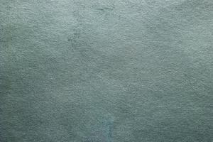 Abstract texture of decorative plaster. Grunge background of stucco texture. Blue grained surface photo