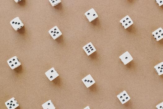 Gaming dice pattern on brown background in flat lay style. Concept with copy space for games, game board, role playing game, risk, chance, good luck or gambling. Toned image top view. Close-up photo