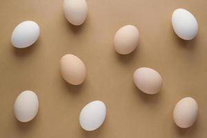 Easter eggs on pastel brown background for holiday. Top view. Flat lay. Minimal concept photo