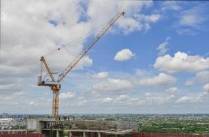 The Crane tower in construction  site of a high-rise condominium. photo