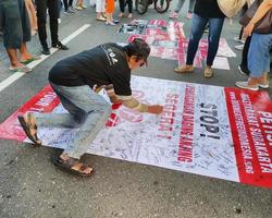 Solo - June 7, 2022 - an Asian tourist signs a petition to stop the dog trade photo