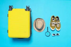 Man accessories lying flat on textured fabric background top view travel concept photo