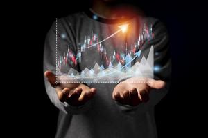 Hand of Businessman or trader is showing a growing virtual hologram stock photo