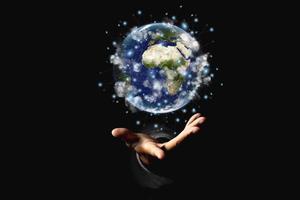 Environment concept. Earth in human hands on black background. Elements of this image furnished by NASA photo