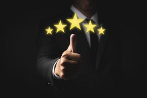 Hand of client giving a five star rating. Service rating, satisfaction concept photo