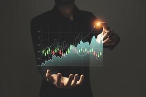 businessman analyzing sales data and economic growth graph chart, e-commerce and network, business strategy. photo