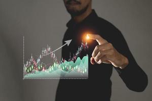 businessman analyzing sales data and economic growth graph chart, e-commerce and network, business strategy. photo