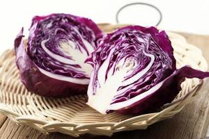 Half Purple Red Cabbage on Rattan Plate, Fresh Picked photo