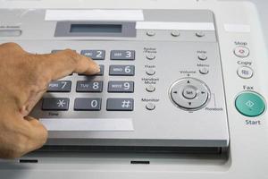 The fax machine for Sending documents in the office photo