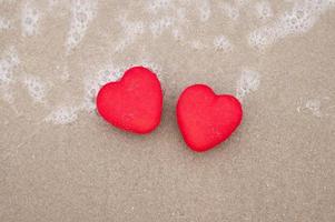 Top View Red heart on a sandy beach concept Valentine day photo