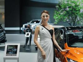 Nonthaburi, Thailand - March 29, 2021 unidentified stand presenter girl at Nissan car booth at Thailand International Motor Show 2021, exhibition of vehicles for sale photo