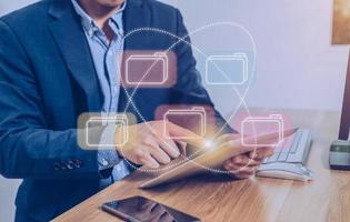 Businessman using a tablet to manage information photo