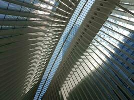 interior of white building with sky light windows and sun photo