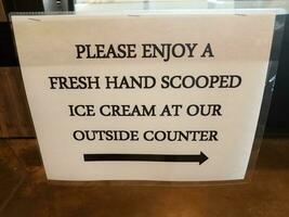 please enjoy a fresh hand scooped ice cream at our outside counter sign photo