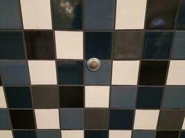 blue and white tile and door stopper photo