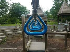 blue metal rings or monkey bars on playground