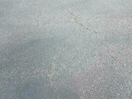 black asphalt or pavement or ground with crack photo