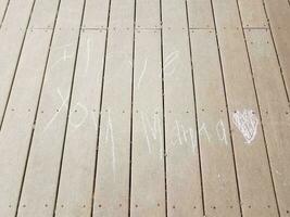 I love you mama message in chalk on wood deck photo