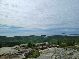 granite rocks and trees view from Cadillac mountain in Maine photo