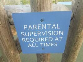 blue parental supervision required at all times sign photo