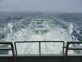 turbulent water from boat motor and sea or ocean photo