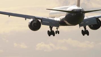 Airliner landing in the morning light. video