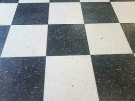 black and white square tile pattern on floor photo