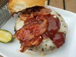 beef hamburger with cheese and bacon and barbecue sauce photo