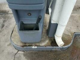 black squeegee and downspout photo