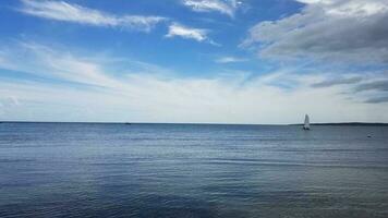 blue calm water and sailboat in Guanica, Puerto Rico photo