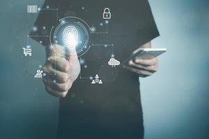 User touching screen to fingerprint scanner with smartphone, security access information, big data management, cloud computing, Internet connection, shopping online and cashless society. photo