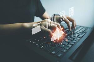 Officer using laptop manage files, Document Management System DMS, Online document database management, automated processes to manage system, ERP enterprise efficient, business technology. photo