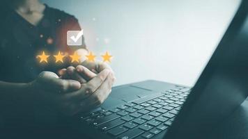 Customer satisfaction assessment rating 5 stars by laptop, User has received excellent service, Review the highest rated service, the best attention, impressed very good service, feedback from guest. photo