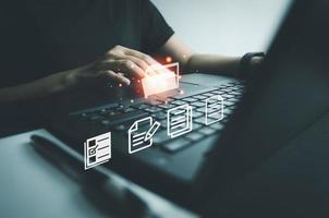 Officer using laptop manage files, Document Management System DMS, Online document database management, automated processes to manage system, ERP enterprise efficient, business technology. photo
