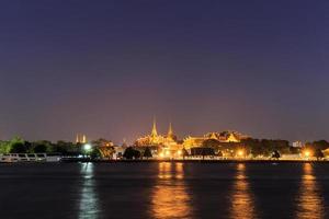 Wat Phra Kaew and Grand Palace alongside river in Bangkok photo