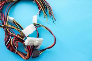 Multi-colored wires from a desktop computer. Wires leading electricity to individual PC components photo