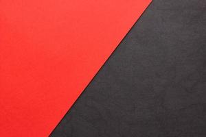 Red and textured black paper background. Abstract banner, poster with place for text. Minimalism photo