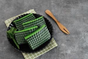 Kue Lapis Pandan or Kue Pepe or sticky layer cake, Indonesian traditional snack made from rice flour photo