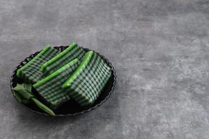 Kue Lapis Pandan or Kue Pepe or sticky layer cake, Indonesian traditional snack made from rice flour photo